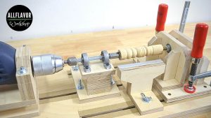 DIY wood lathe made from plywood and powered by a drill for turning small wood parts.