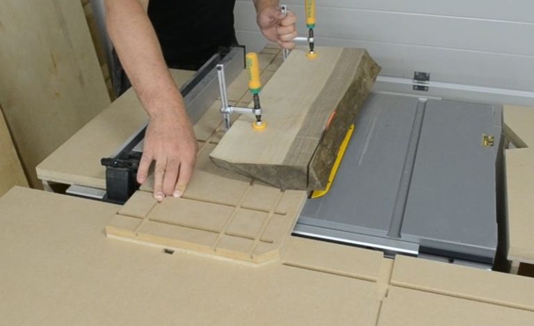 Cutting board held in a jointer sled for straightening one edge