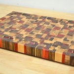 DIY chaotic end grain cutting board made from padauk, walnut, ash, and beech — colorful random wood pattern and smooth finish.