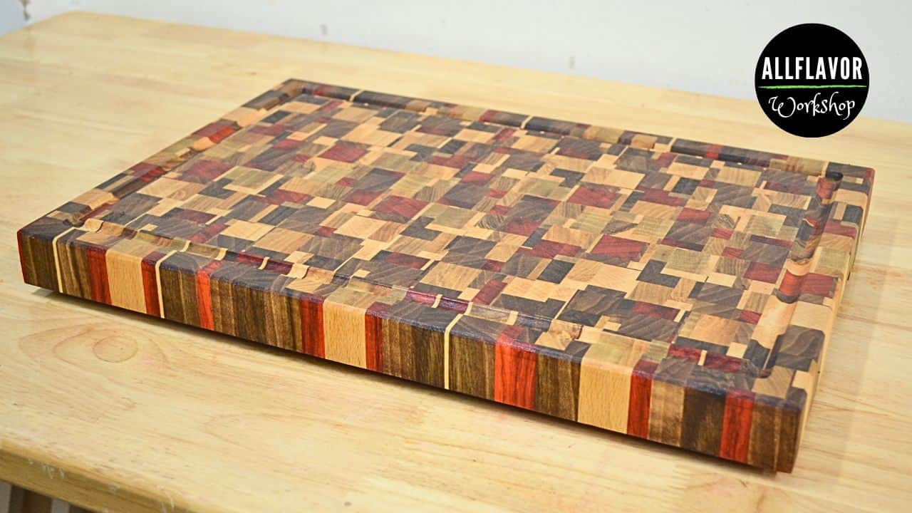 DIY chaotic end grain cutting board made from padauk, walnut, ash, and beech — colorful random wood pattern and smooth finish.