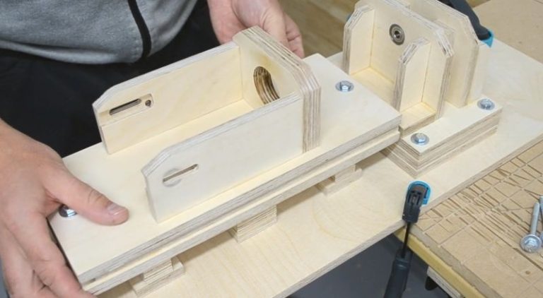 A removable drill press holder mounted on a drill disc sander.