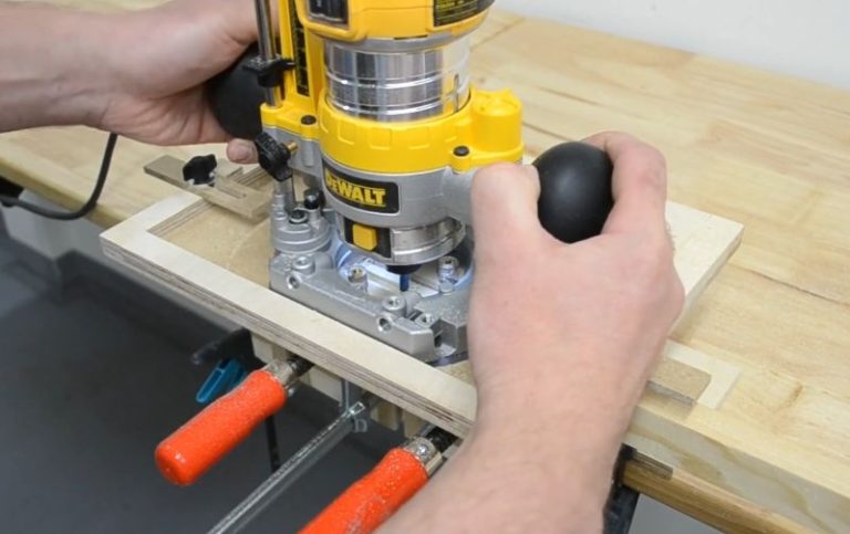 Router mortising jig with T-track fence and guide rails for plunge router.