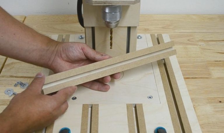 Close-up of a DIY T-track fence that together with clamps can be used for multiple jig builds.