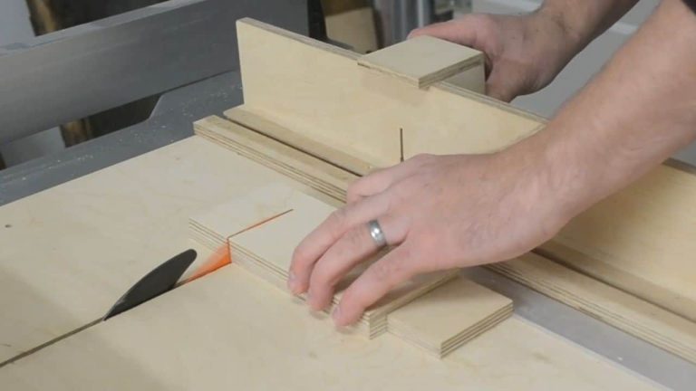 Two plywood boards stacked together on a workbench