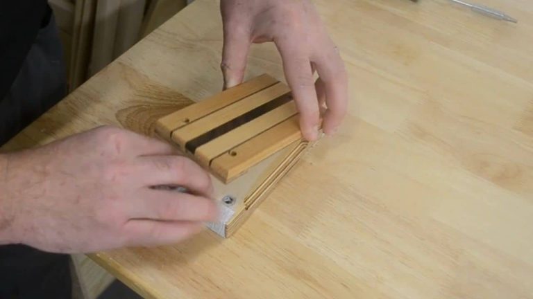 Swapping sandpaper in a two-piece wooden sanding block