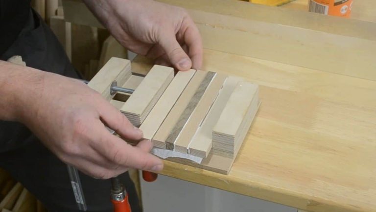 Wood strips clamped in a drill press vise during glue-up
