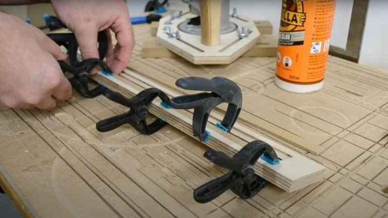 Applying wood glue in plywood dados to glue MDF strips for the T-track fence