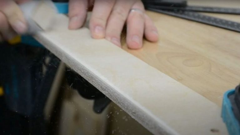 Beveling the fence edge on the table saw and drilling a mounting hole for attachment