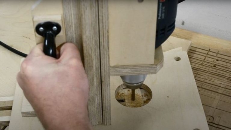 Drilling a hole through the table saw sled to attach the hexagon jig fence