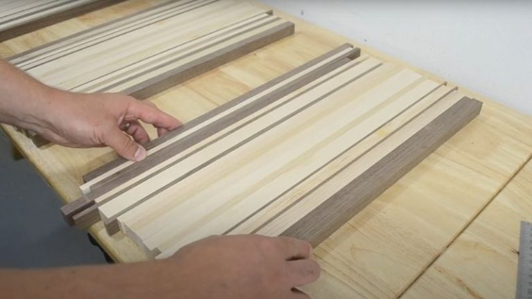 Arranging walnut, ash, and beech strips from dark to light for the ombré cutting board pattern.