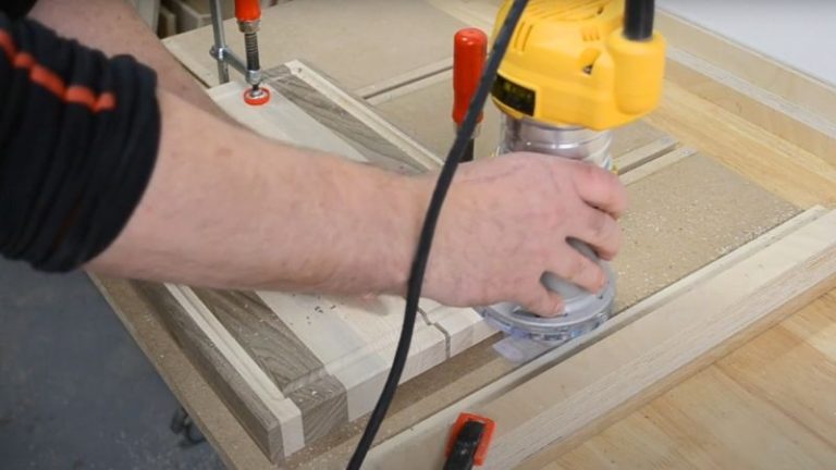 Beveling the outside edges of a cutting board with a 45-degree chamfer bit.
