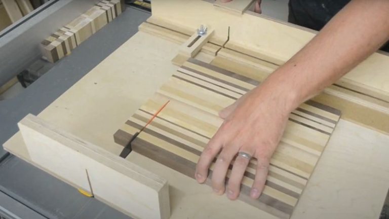 Cutting edge grain panels into 3.4 cm strips using a table saw sled.