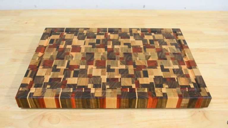Finished chaotic end grain cutting board with padauk, walnut, ash, and beech showing rich color contrast.