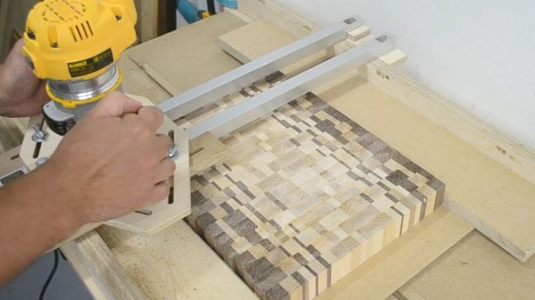 Flattening an end grain cutting board using a router flattening jig and a trim router.
