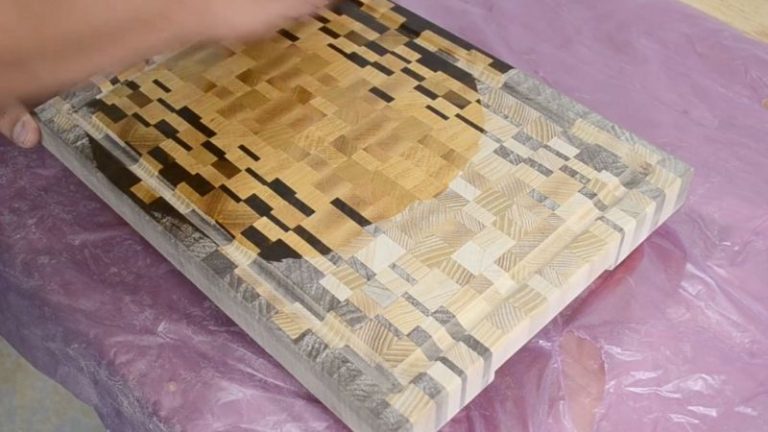 Applying food-safe oil to an ombré end grain cutting board.