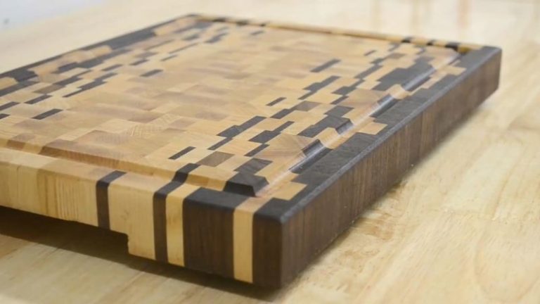 Close-up of an ombré end grain cutting board highlighting the grain pattern and color transition.