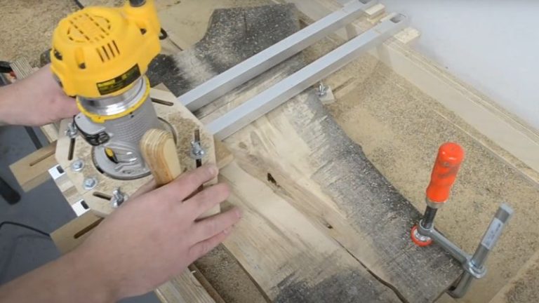 Routing the walnut slab surface using a router flattening jig and surfacing bit.