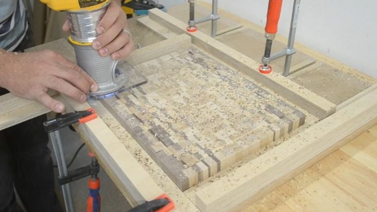 Routing a juice groove into an ombré end grain cutting board using a trim router.