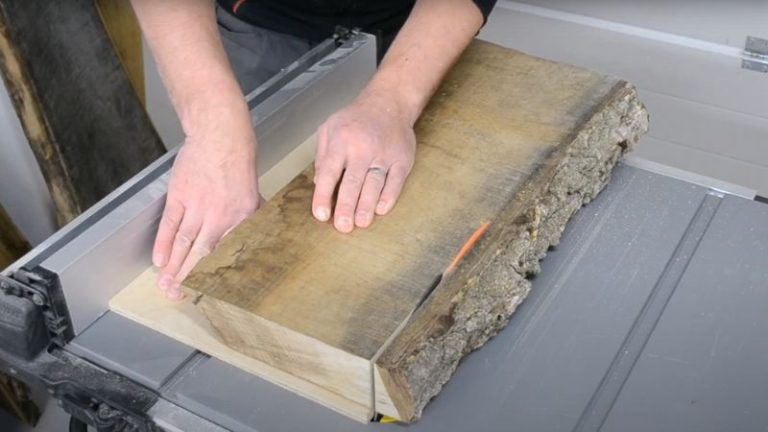 Straightening a walnut slab with live edges using a jointer sled.