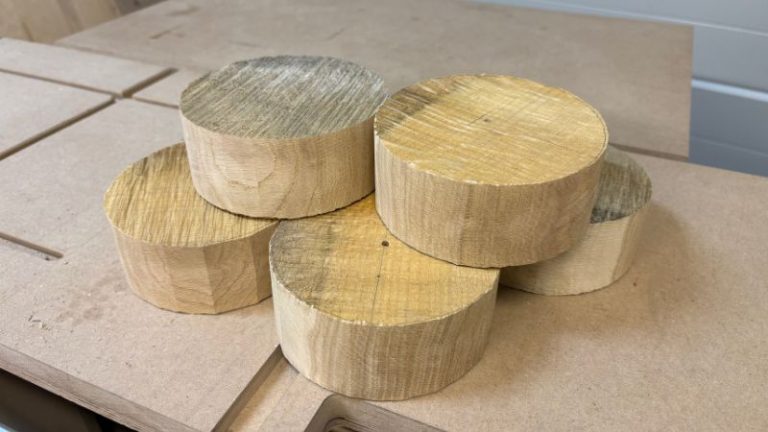 Six round oak bowl blanks with center pilot holes ready for faceplate mounting