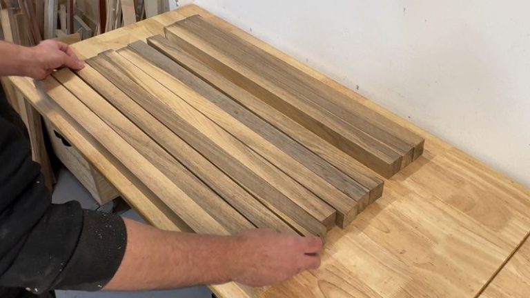 Walnut strips laid out on the bench, alternating heartwood and sapwood to form a cutting board pattern.