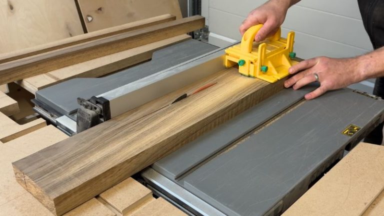 Walnut board being ripped into uniform strips on the table saw.