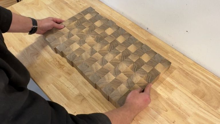 Walnut end grain blocks stood on edge and arranged into a pattern on the workbench.