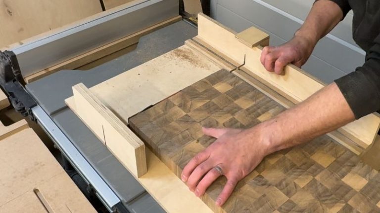 End grain cutting board on a table saw sled, trimming the end to square the corners.