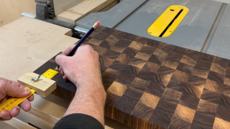 Ruler marking gauge used to mark hole positions for rubber feet on the underside of a cutting board.