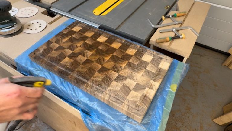 Light mist of water sprayed on an end grain cutting board to raise the grain before final sanding.