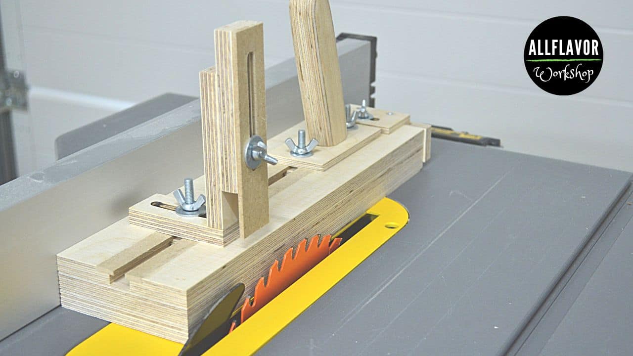 DIY table saw thin strip jig with handle, hold-down clamp, and back stopper mounted on the saw fence for safe, repeatable thin rips.