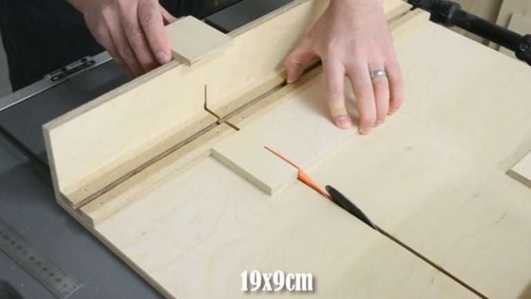 Crosscutting the push block base pieces to final length on a table saw sled for square ends.
