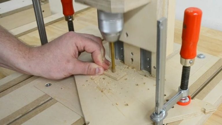 Drilling bolt holes in the upper pieces of the adjustable center leg for the push block.