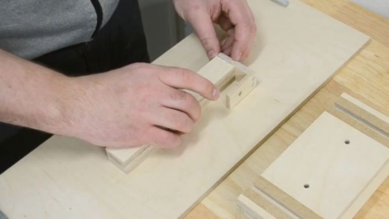 Gluing the main leg, side pieces, and upper pieces together to form the adjustable center leg block.