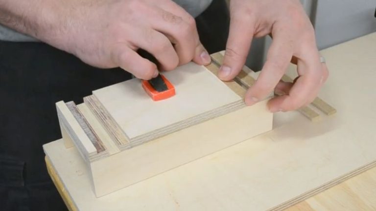 Gluing MDF strips into the shallow outer dados to form a T-track on the push block base.