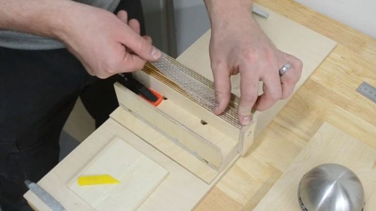 Applying epoxy and gluing rubber pad strips to the bottom of the push block legs.