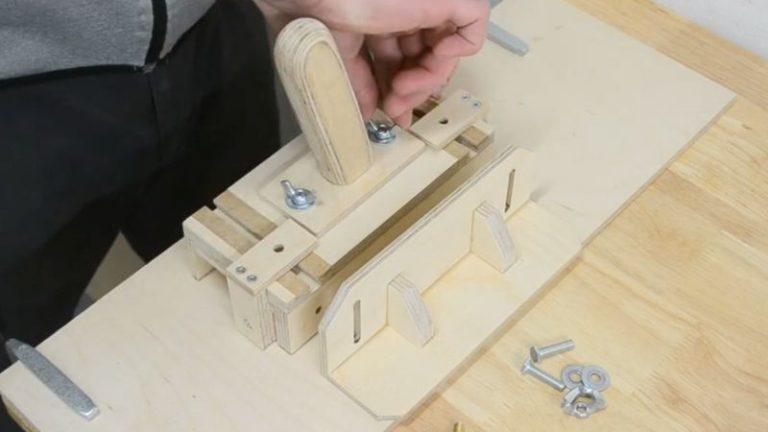 Installing the removable handle on top of the DIY table saw push block using bolts and wing nuts.
