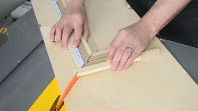 Cutting the first 45-degree miter on the shorter fence of the picture frame jig with the rabbet against the fence.