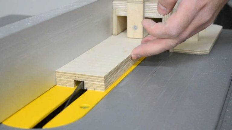 Cutting T-track slots in the picture frame jig fence on the table saw.