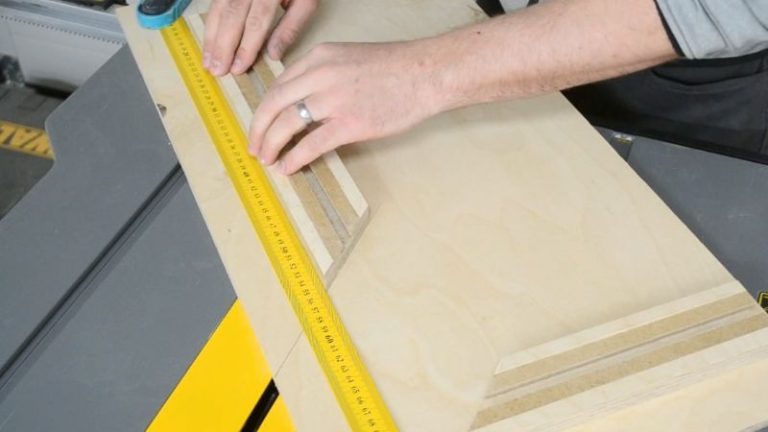 Gluing and clamping the longer fence to the plywood base of the table saw picture frame jig.