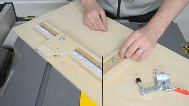 Stop block aligned with the self-adhesive ruler on the picture frame jig fence to set frame length.