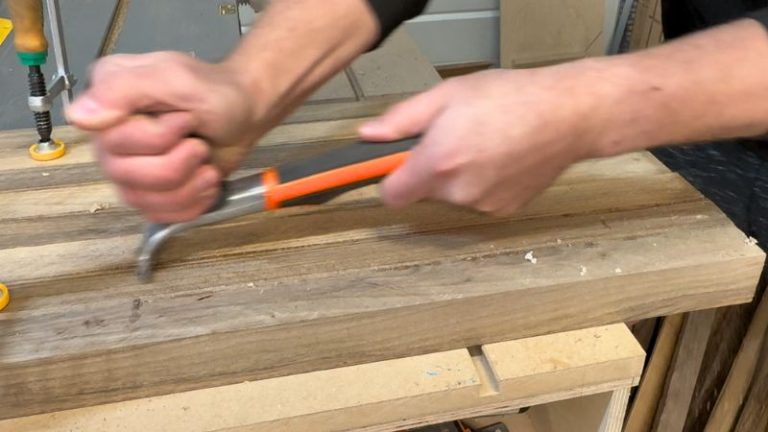 Removing dried glue squeeze-out from a cutting board glue-up before planing.