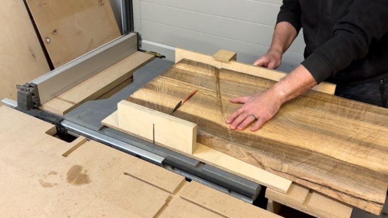 Trimming cracked walnut slab ends using a table saw sled to create a smaller, cleaner blank.