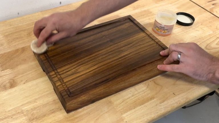 Applying Clark’s wax to a walnut cutting board to protect it.