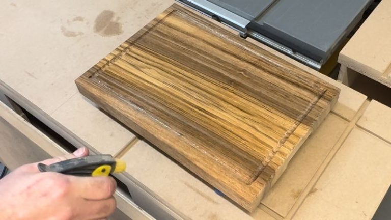 Light mist of water sprayed on a walnut cutting board to raise the grain before final sanding.