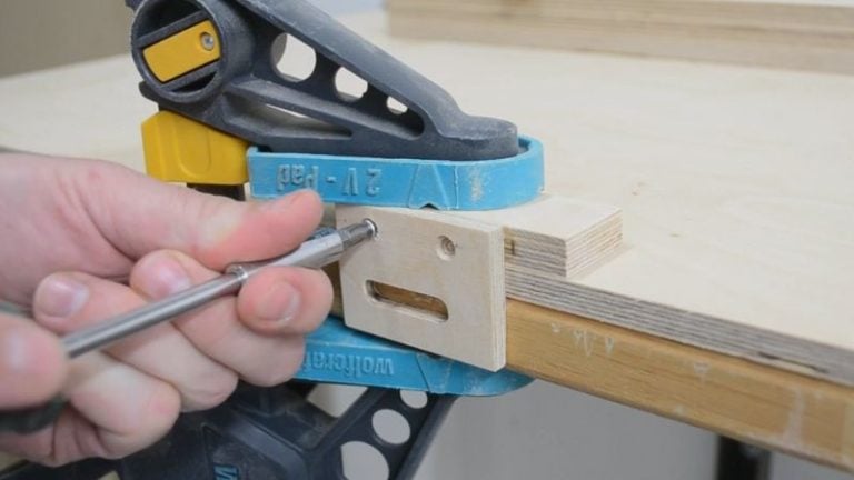 Back stopper pieces screwed together at 90 degrees on the workbench.