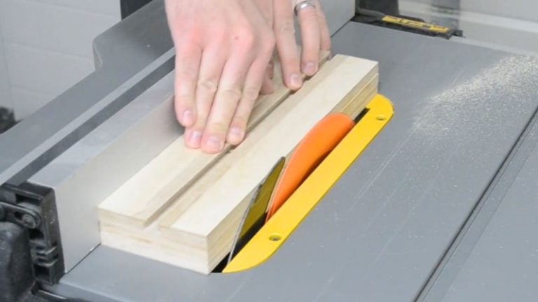 Jig base being trimmed lightly on the table saw to clean and straighten the outer edges.
