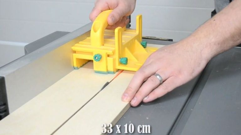 Cutting three plywood base pieces to 33 × 10 cm on a table saw for a thin strip jig.