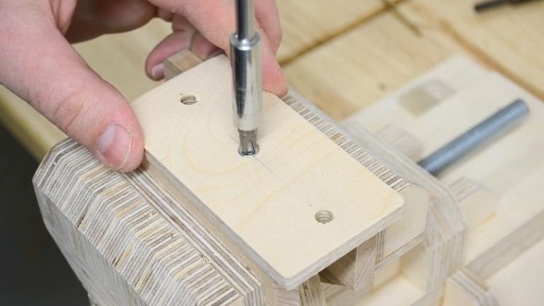 Plywood handle glued onto a thin plywood base with a screw added from the bottom for strength.