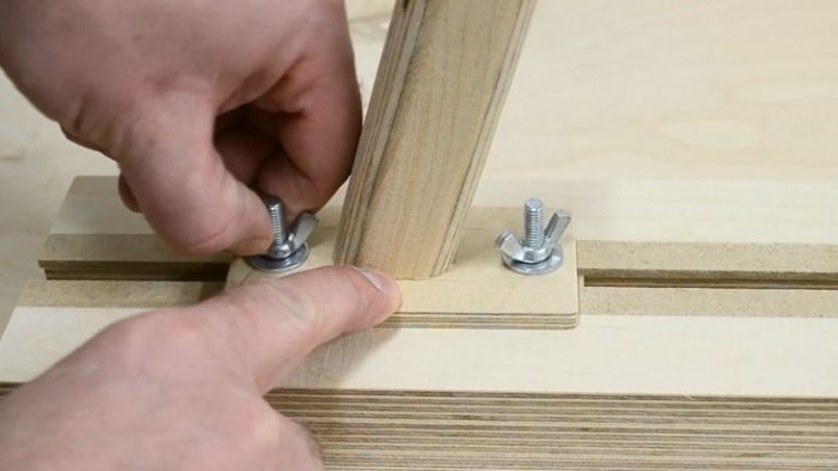 Finished handle mounted on the thin strip jig base using T-track bolts and wing nuts.